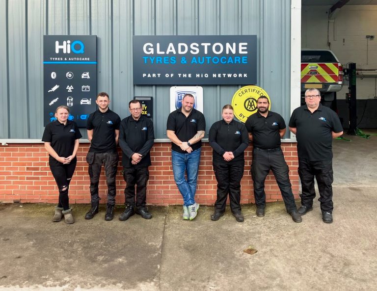 The team at Gladstone Tyre & Autocare in York in black shirts standing in front of the garage